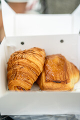 Croissant in take away box
