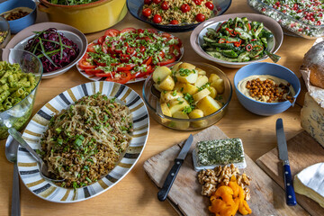 A high angle view of a table laden with healthy dishes for a buffet lunch