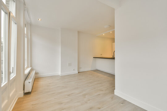 An empty living room and kitchen in a new home