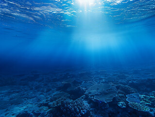 A vast blue ocean with a bright sun shining down on the water