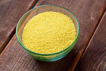 crumbly couscous cereal in a glass bowl on the table