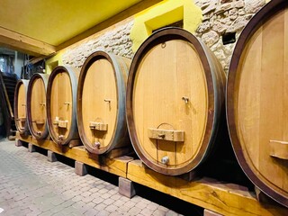 Barrels in a wine cellar. Tour in Katzenthal , Alsace, France