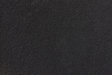 Black textured wall background. Dark texture.