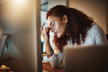 Business woman, computer and headache at night with stress, fatigue and burnout in dark office....