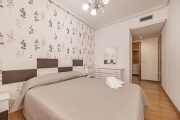Double bedroom with air conditioning through ceiling ducts, dressing room and private bathroom in one corner