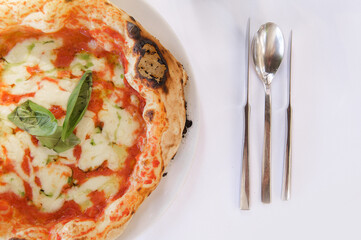 Margherita Pizza with Fresh Basil on Table