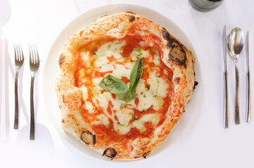 Margherita Pizza with Basil on White Tablecloth