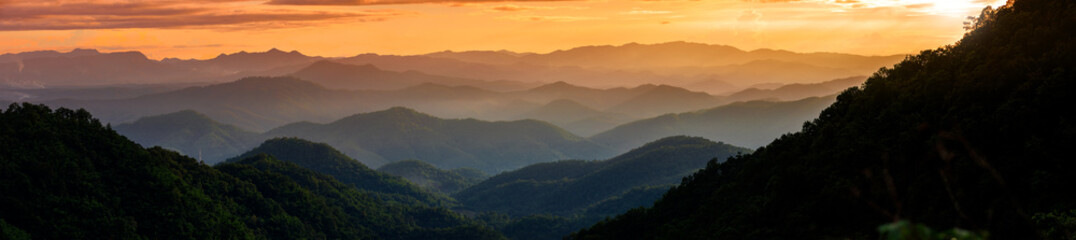 panorama of blue mountains valley landscape at sunset