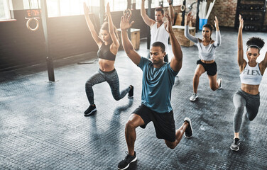 Friends, fitness and lunge in group at gym for workout, core exercise or training together indoors....