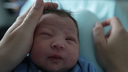 Newborn baby sleeping peacefully, mother's hand caressing infant serene and content expression emphasizes the essence of tranquility and warmth in early infancy-1.jpegNewborn baby sleeping peacefully,