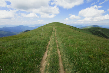 Ostredok, Velka Fatra, Slovakia. Path, pathway and footpath to the top and summit of hill and mountain. Summer with clouds in the sky.