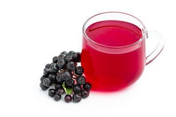 Black chokeberry juice and fresh berries isolated in white