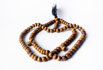 brown prayer beads made from high quality natural wood isolated on white