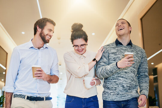 Business people, happy and coffee break in office with laughing for comedy joke, collaboration and relax together. Employees, men and woman with latte drinks, funny conversation and gossip story