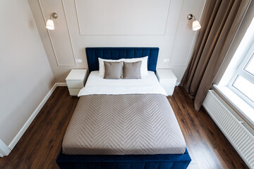 Detailed description of a bedroom with bed, nightstands, focusing on layout and furniture to create...