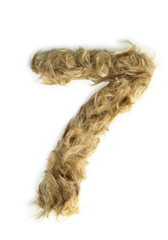 Creative typography made with real dog hair. Blonde hair on white background Dogs, cats, pets, monsters and other furry animals. Complete alphabet. Number 7