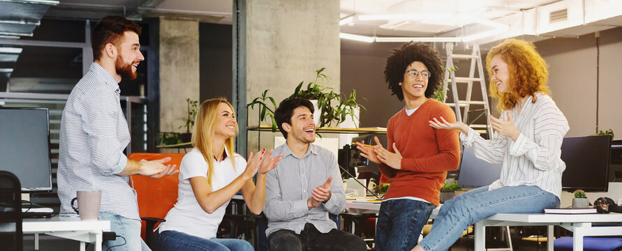 Group multiethnic business people applauding to new member of team with happy action in modern workplace, panorama
