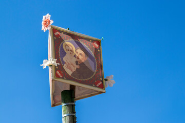 Colorful flag of Saint Anthony on a wooden pole for June festival decoration in Brazil