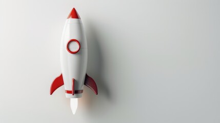 Toy rocket spaceship on white background, minimalistic design, children's creativity and imagination concept