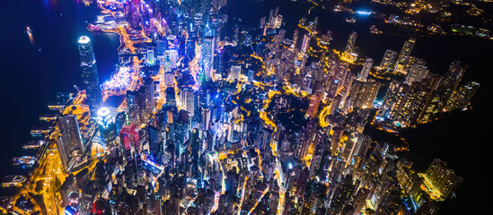 Epic aerial view of night of Hong Kong, Victoria Harbour. with cyberpunk color