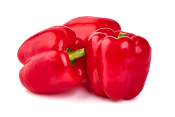 Red ripe bellpeppers, isolated on white background.