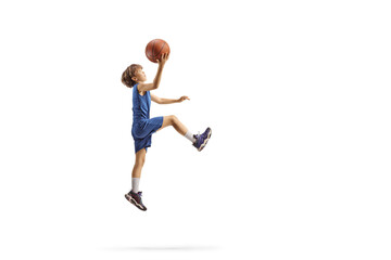 Boy jumping with a basketball