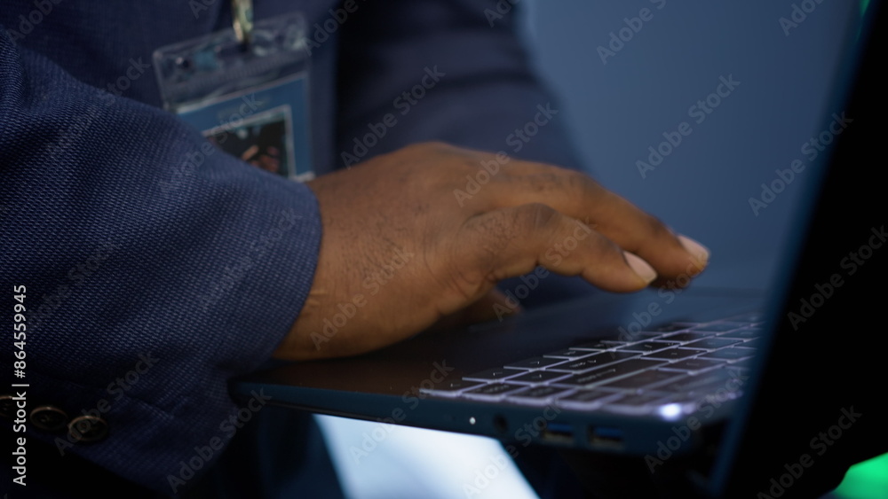 Poster it technician working on notebook in data center, overseeing server operations. extreme close up sho