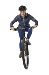 Beautiful young woman in helmet riding bicycle on white background
