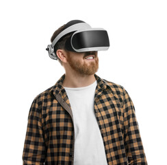 Smiling man using virtual reality headset on white background