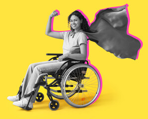 Beautiful young African-American happy woman in wheelchair and superhero cape on yellow background