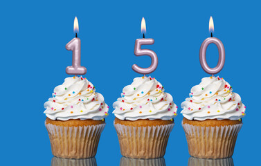 Birthday Cupcakes With Candles Lit Forming The Number 150