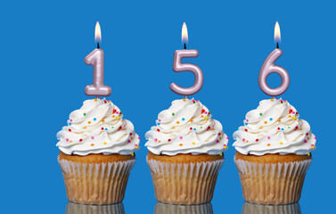 Birthday Cupcakes With Candles Lit Forming The Number 156