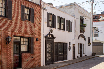 Brick rowhouses with shutters in historic Mount Vernon in Baltimore