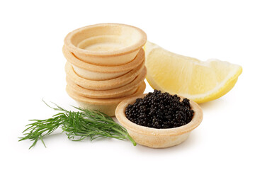 Tasty tartlets with black caviar and lemon on white background