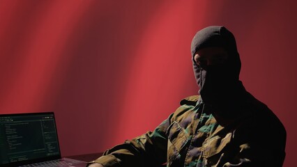 China secret police agent using mass propaganda tools on laptop to influence population minds,...