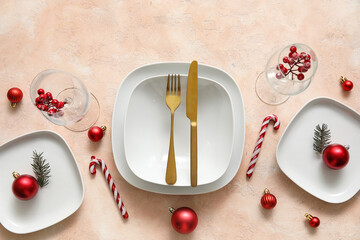 Festive table setting with Christmas decorations on beige grunge background