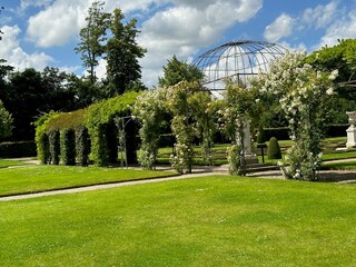 Tunnels made of plants and green grass in park