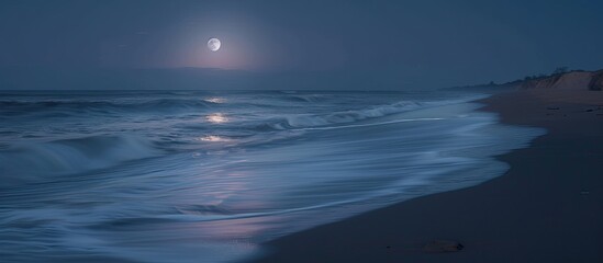 Fototapeta premium Capture a serene beach scene under a full moon with soft waves through a long exposure for a stunning copy space image.