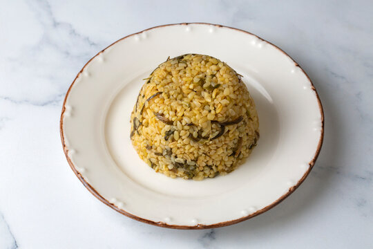 Herbed bulgur pilaf. "Keledos and Ciris herbed" bulgur from Van region of Turkey. Turkish name; Otlu bulgur pilavi