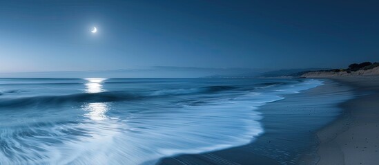 Fototapeta premium Capture a serene beach scene under a full moon with soft waves through a long exposure for a stunning copy space image.