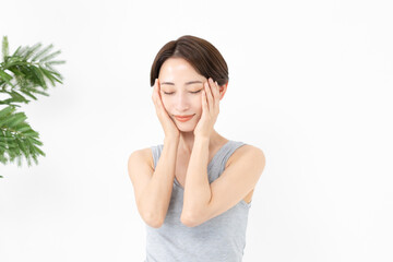 Fototapeta premium 頬を触るミドル女性