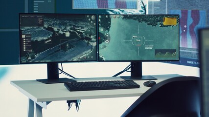 Military operations control room used in following global threats on a big screen, empty federal...