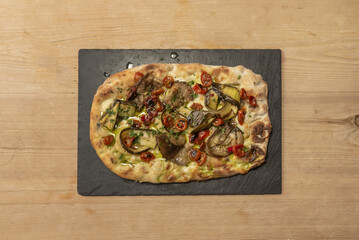 Vegetarian, a healthy and colorful option that includes a variety of fresh vegetables such as peppers, mushrooms, onions, tomatoes and olives