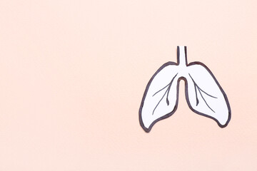 Drawn paper lungs on beige background