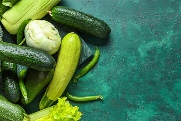 Different fresh vegetables on green background