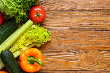 Different fresh vegetables on wooden background