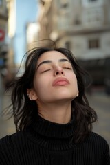 Fototapeta premium Woman with eyes closed looking upwards