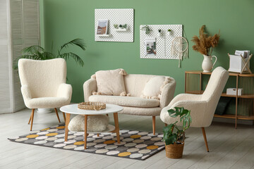 Stylish living room with soft sofa, armchairs, coffee table and pegboard
