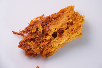Macro shot of homemade honeycomb made using white sugar and bicarbonate powder