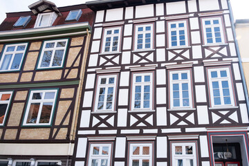 Fototapeta premium fragments old house, medieval building 13th century in European city, half-timbered style facades, wooden frames load-bearing structures, German heritage, history